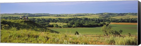 Framed Three mountain bikers on a hill, Kansas, USA Print