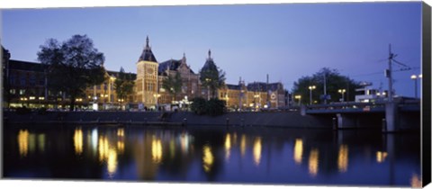 Framed Reflection of a railway station in water, Amsterdam Central Station, Amsterdam, Netherlands Print