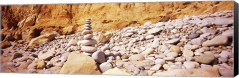 Framed Stack of stones on the beach, California, USA Print