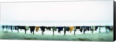 Framed Clothes drying at the riverbank, Ganges River, Varanasi, Uttar Pradesh, India Print