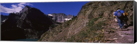 Framed Hikers hiking on a mountain, US Glacier National Park, Montana, USA Print