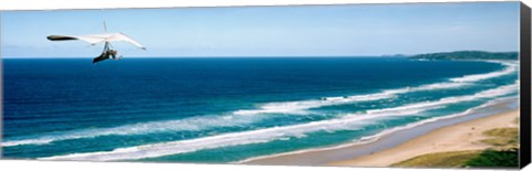 Framed Hang glider over the sea Print