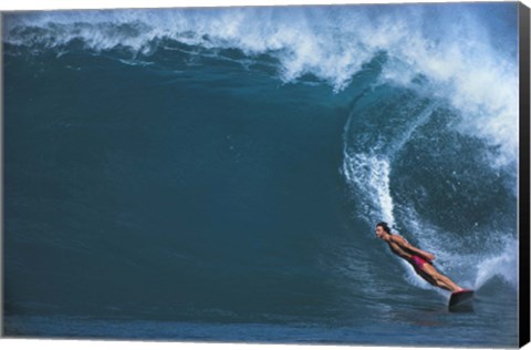 Framed Man surfing in the sea Print