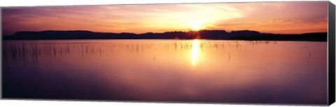 Framed Reflection of sun on water at dawn, Elephant Butte Lake, New Mexico, USA Print