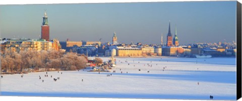 Framed People strolling across frozen Riddarfjarden, Riddarholmen, Stockholm, Sweden Print