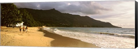 Framed People walking along the Beau Vallon beach, Mahe Island, Seychelles Print