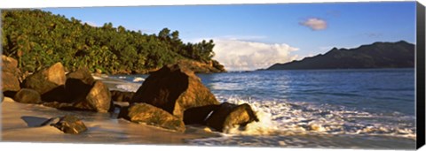 Framed Waves splashing onto rocks on North Island with Silhouette Island in the background, Seychelles Print