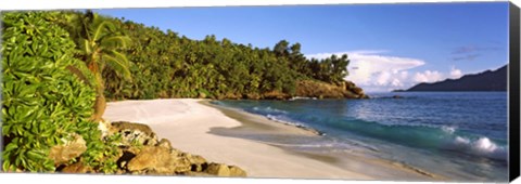 Framed Waves breaking on a small secluded beach on North Island, Seychelles Print