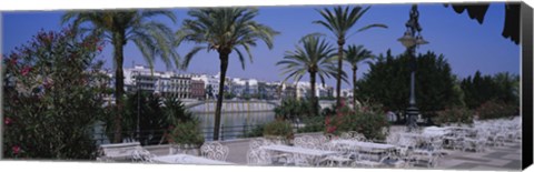 Framed Sidewalk cafe at the riverside, Guadalquivir River, Seville, Spain Print