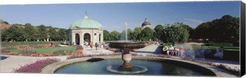 Framed Germany, Munich, Hofgarten, Tourist sitting in the park Print