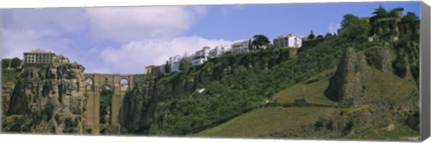 Framed Low angle view of a town, Tajo Bridge, Rio Guadalevin Gorge, Serrania De Ronda, Ronda, Andalusia, Spain Print