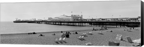 Framed Tourists on the beach, Brighton, England Print