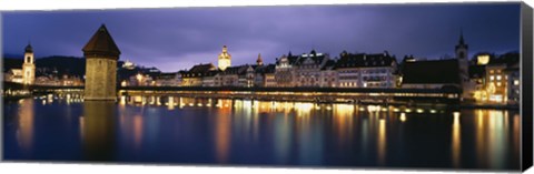 Framed Buildings lit up at dusk, Chapel Bridge, Reuss River, Lucerne, Switzerland Print