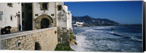 Framed Tourists in a church beside the sea, Sitges, Spain Print