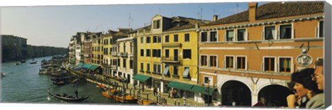 Framed Tourists looking at gondolas in a canal, Venice, Italy Print