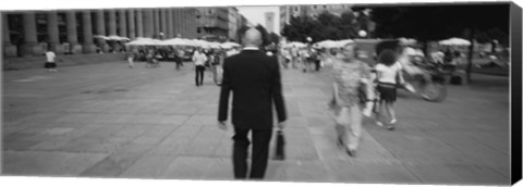 Framed Rear view of a businessman walking on the street, Stuttgart, Germany Print