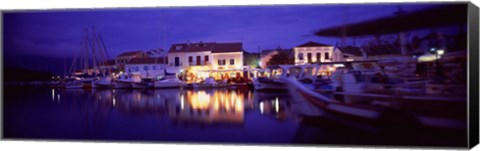 Framed Greece, Cephalonia, Light illuminated on harbor and outdoors cafe Print