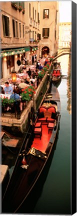 Framed Gondolas moored outside of a cafe, Venice, Italy Print