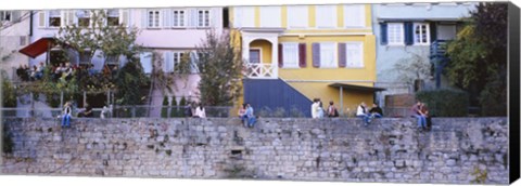 Framed Low Angle View Of A Group Of People Sitting On A Wall, Tubingen, Baden-Wurttemberg, Germany Print