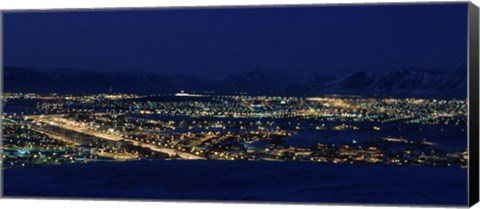 Framed High angle view of city lit up at night, Reykjavik, Iceland Print