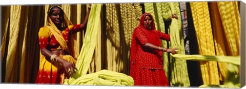 Framed Portrait of two mature women working in a textile industry, Rajasthan, India Print