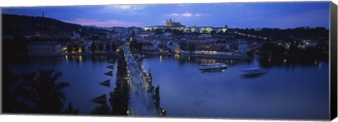 Framed High angle view of buildings lit up at dusk, Charles Bridge, Vltava River, Prague, Czech Republic Print