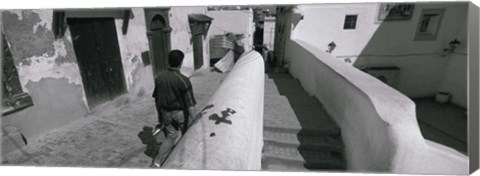 Framed Rear view of a man walking in front of a building, Casaba, Algiers, Algeria Print