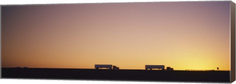 Framed Silhouette of two trucks moving on a highway, Interstate 5, California, USA Print