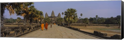 Framed Two monks walking in front of an old temple, Angkor Wat, Siem Reap, Cambodia Print