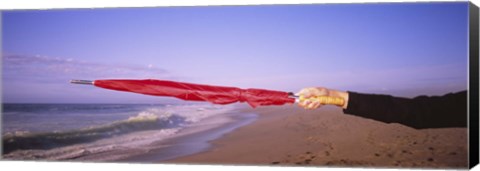 Framed Close-up of a woman&#39;s hand pointing with a red umbrella, Point Reyes National Seashore, California, USA Print