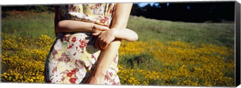 Framed Mid section view of a girl hugging her mother in a field, Marin County, California, USA Print