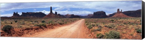 Framed Dirt road through desert landscape with sandstone formations, Utah. Print