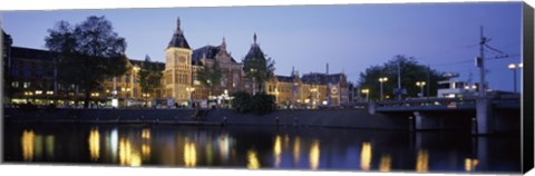 Framed Reflection of a railway station in water, Amsterdam Central Station, Amsterdam, Netherlands Print