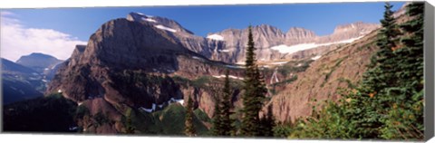 Framed Trees with a mountain range in the background, US Glacier National Park, Montana, USA Print