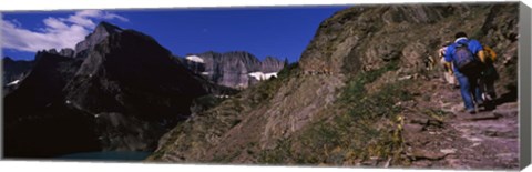 Framed Hikers hiking on a mountain, US Glacier National Park, Montana, USA Print