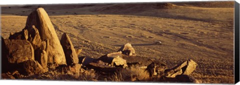 Framed Rocks in a desert, overview of tourist vehicle, Namibia Print