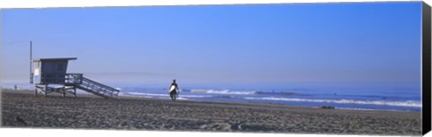 Framed Rear view of a surfer on the beach, Santa Monica, Los Angeles County, California, USA Print