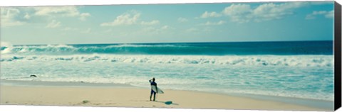 Framed Surfer standing on the beach, North Shore, Oahu, Hawaii Print