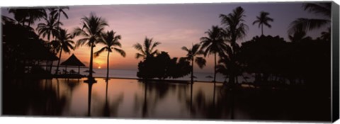 Framed Sunset over hotel pool, Lombok, West Nusa Tenggara, Indonesia Print