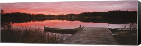 Framed Canoe tied to dock on a small lake at sunset, Sweden Print