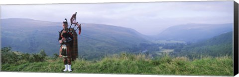 Framed Bagpiper at Loch Broom in Scottish highlands, Ross and Cromarty, Scotland Print