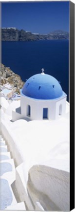 Framed High angle view of a church with blue dome, Oia, Santorini, Cyclades Islands, Greece Print