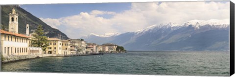 Framed Buildings at the waterfront with snowcapped mountain in the background, Gargnano, Monte Baldo, Lake Garda, Lombardy, Italy Print