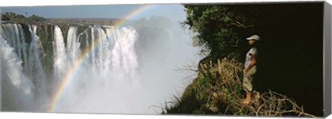 Framed Woman looking at a rainbow over the Victoria Falls, Zimbabwe Print