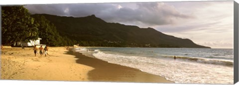 Framed People walking along the Beau Vallon beach, Mahe Island, Seychelles Print