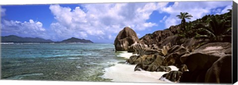 Framed Rock formations on the beach on Anse Source d&#39;Argent beach with Praslin Island in the background, La Digue Island, Seychelles Print