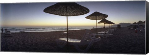 Framed Beach chairs and straw sun umbrellas on Patara Beach on the Mediterranean Sea at sunset, Patara, Antalya Province, Turkey Print