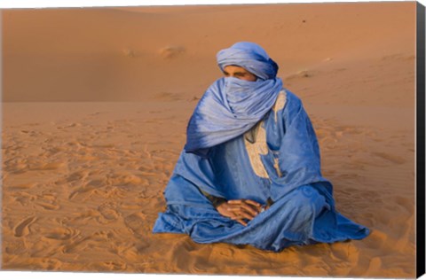 Framed Veiled Tuareg man sitting cross-legged on the sand, Erg Chebbi, Morocco Print