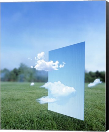 Framed White clouds passing through a pale blue horizontal of sky with green grass, trees and sky in the distance Print