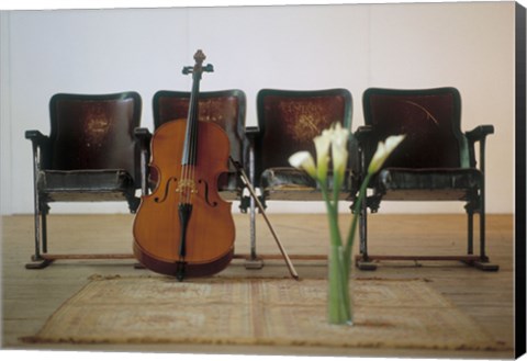 Framed Cello leaning on attached chairs Print